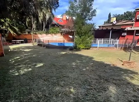 Terreno con la casa al fondo